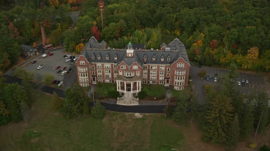 Aerial view of a hotel in the middle of a forest