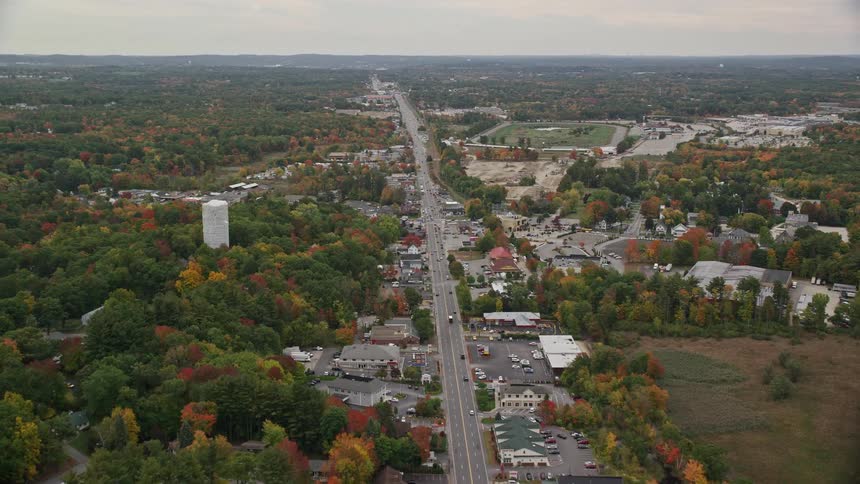 Aerial view of highway through suburbs in fall