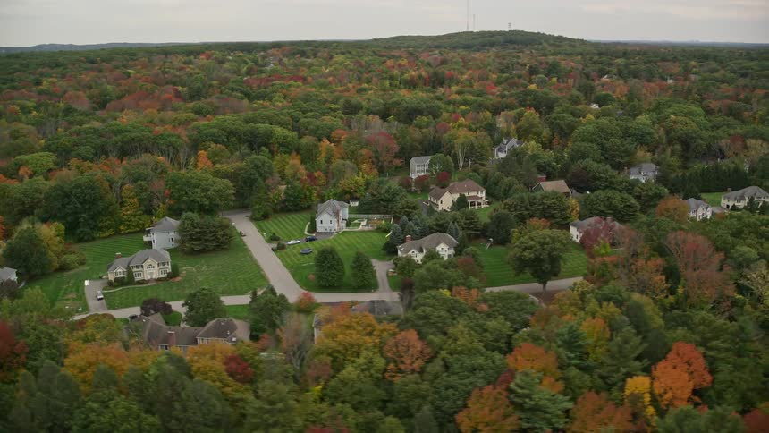 From high above a view of the countryside and its autumnclad forest paints a serene picture of the seasons transition