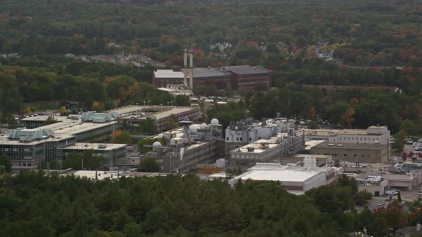 Aerial view of a factory in the midst of a forest