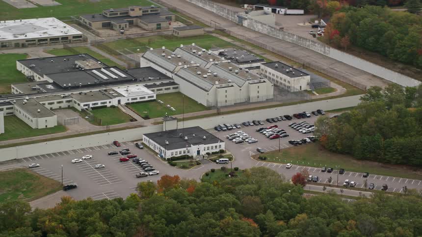 Aerial view of a prison in the midst of a wooded area