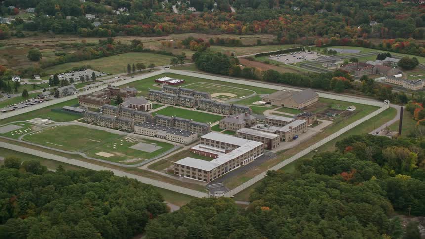 A campus with some buildings and lots of grass around it