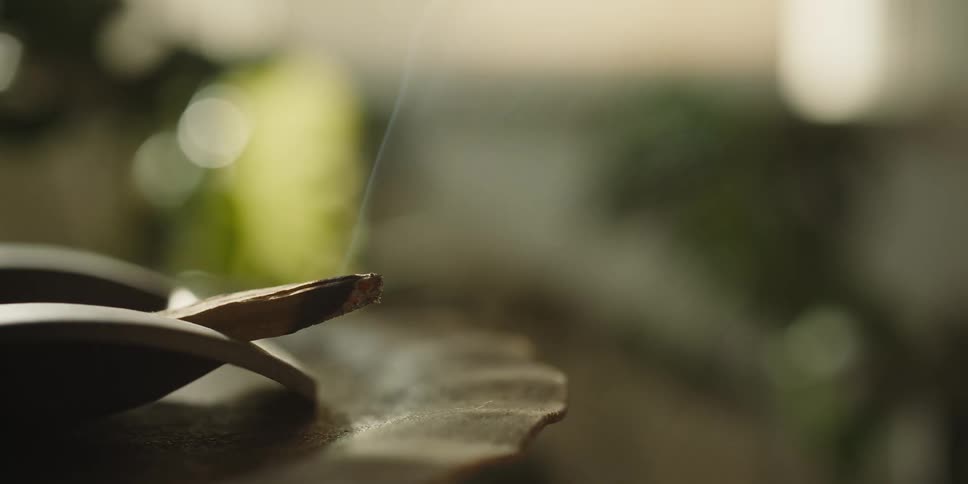 Closeup of incense emitting smoke