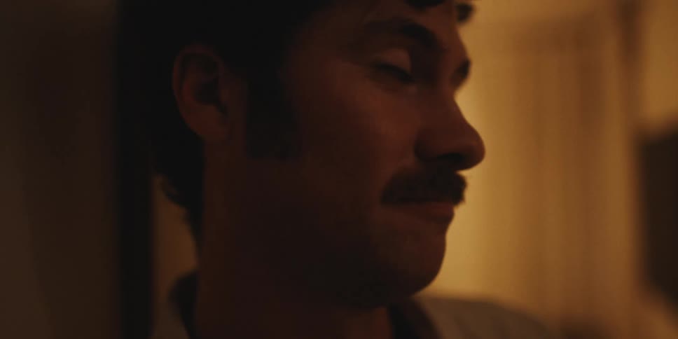 Closeup of a mans face talking to someone