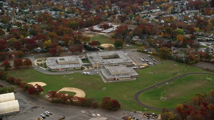 Aerial of the school with sports fields in a neighborhood