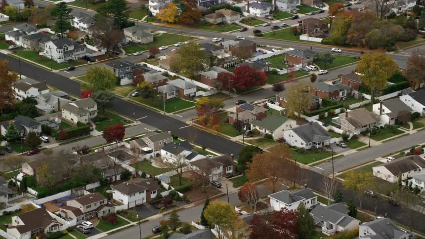 A residential community is filled with numerous twostory homes