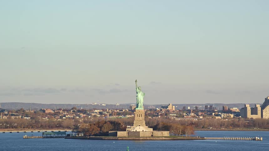 The statue of liberty is located atop a small island near new york city