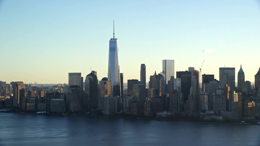 Aerial view of the lower manhattan skyline across the hudson river at sunrise