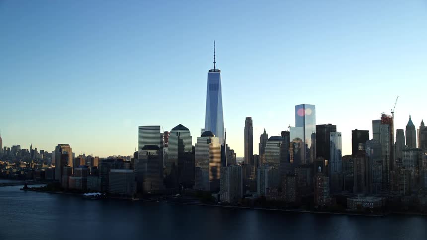 Landscape of skyscrapers at waterfront in a metropolitan area at dusk