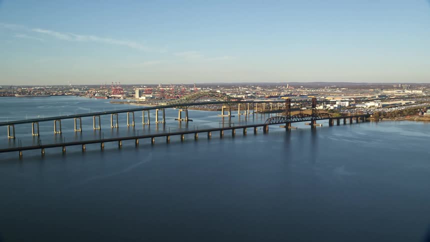 Aerial view of an urban city by the sea with interconnecting bridges