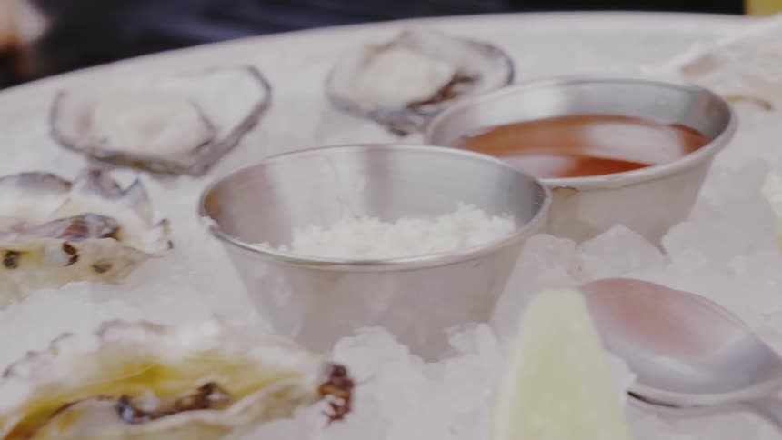 A table with several bowls full of ingredients