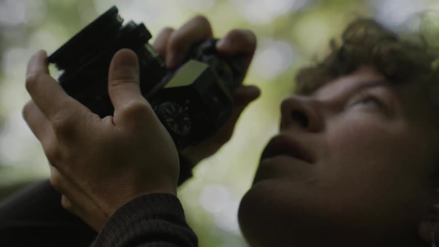 Woman taking photo in nature