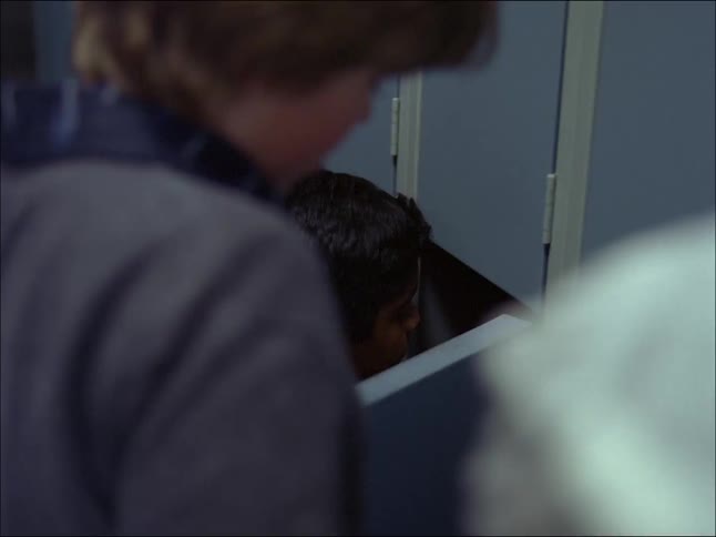 A clip of kids standing and using the closet