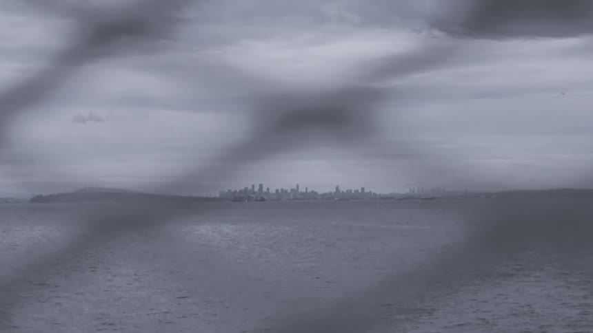 Vancouver viewed from the sea through a ferries rail