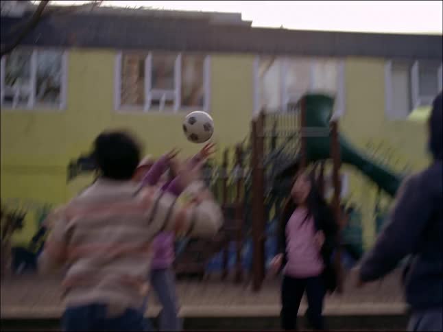 Children playing with a ball at the school playground