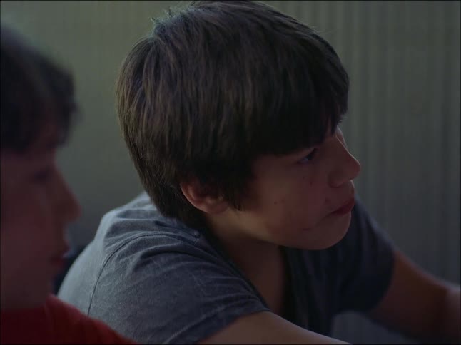 Portrait of two boys sitting and talking