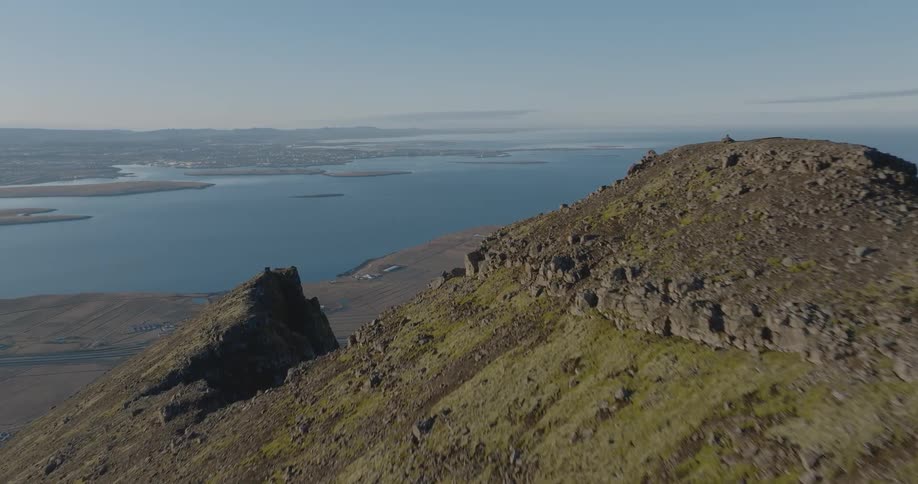 Aerial view of a mountain peak overlooking the sea