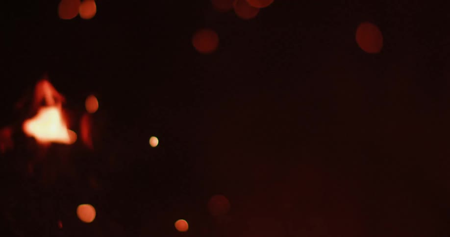 A camp fire burning at night