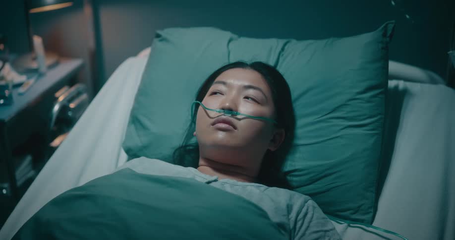 Sleepy woman lying on a hospital stretcher