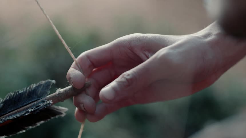 Archer holding his arrow ready to shoot