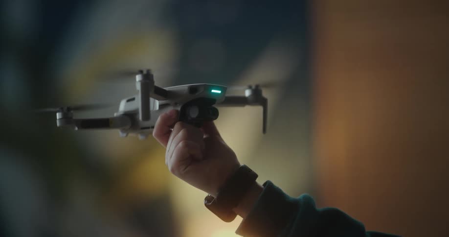 A child playing with a flying drone at home