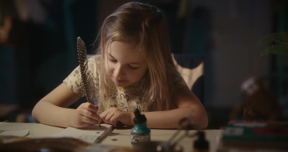 Young girl writing with a quill pen