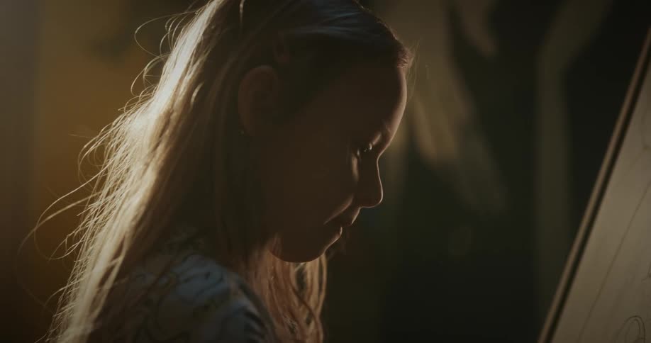 A close up picture of a girl in the room