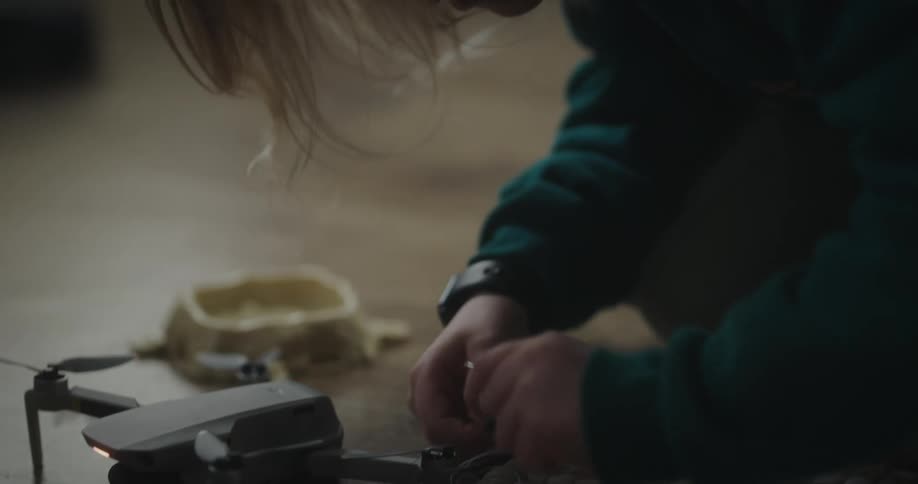 Child assembling a drone