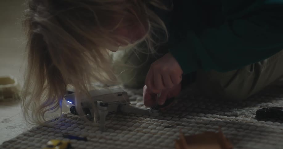 Girl using a tool on a drone
