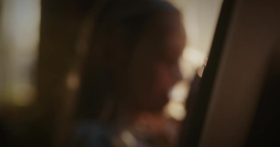 Portrait of a blonde girl drinking from a glass