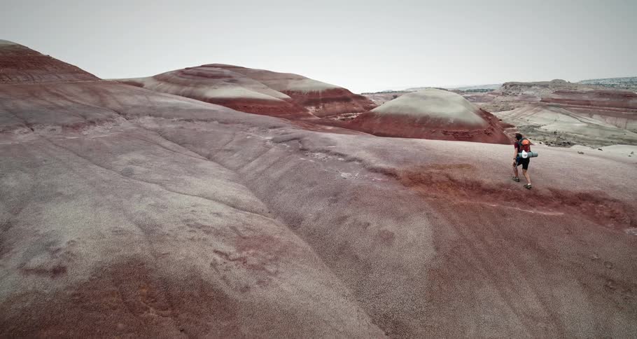 Man climbing geological mountains
