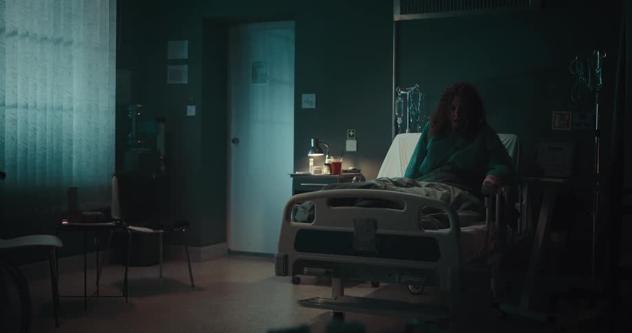 A depressed patient on a sick bed in the hospital