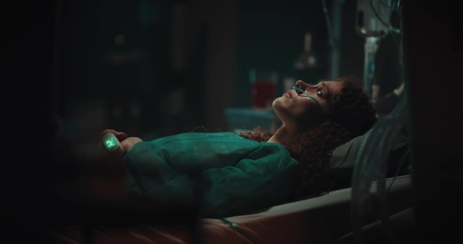 A patient in the hospital bed looking up