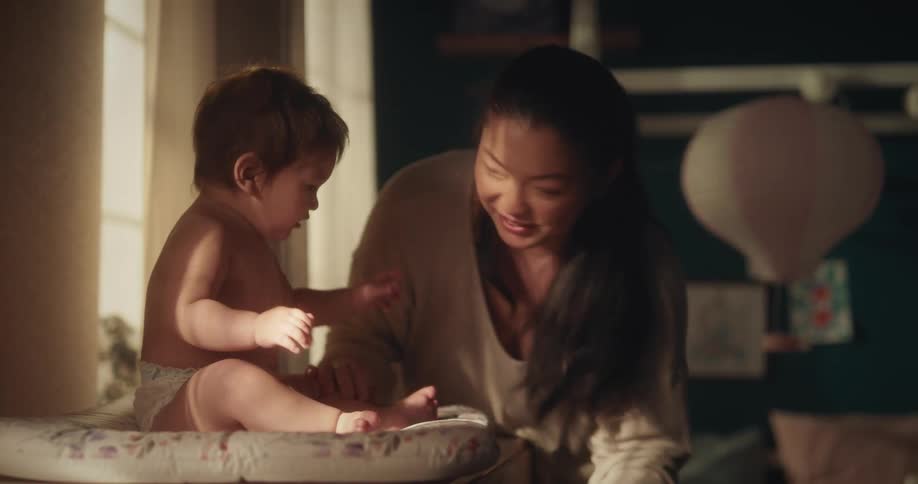 A asian woman playing with her toddler