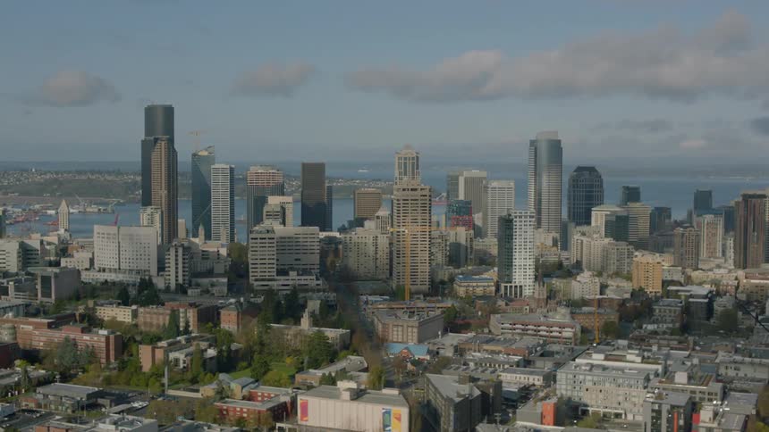 The city has tall buildings near the water