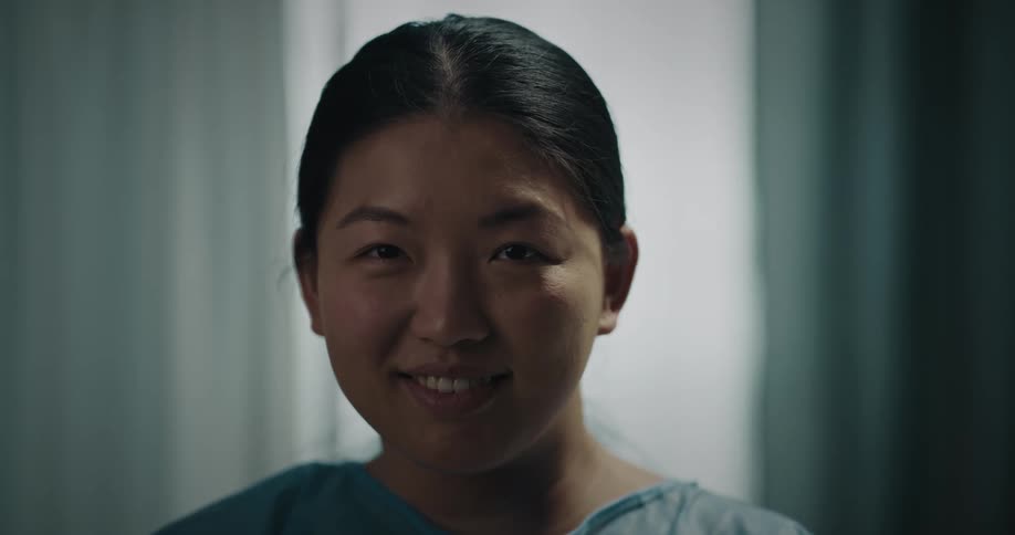 A woman opens her eyes and smiles
