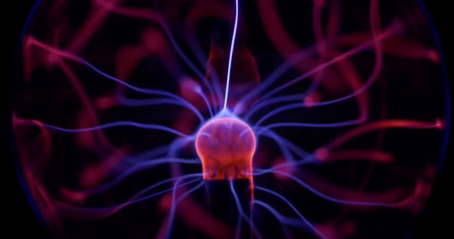 Glowing purple wisps move inside an orb of electric energy from a phosphorescent pink object