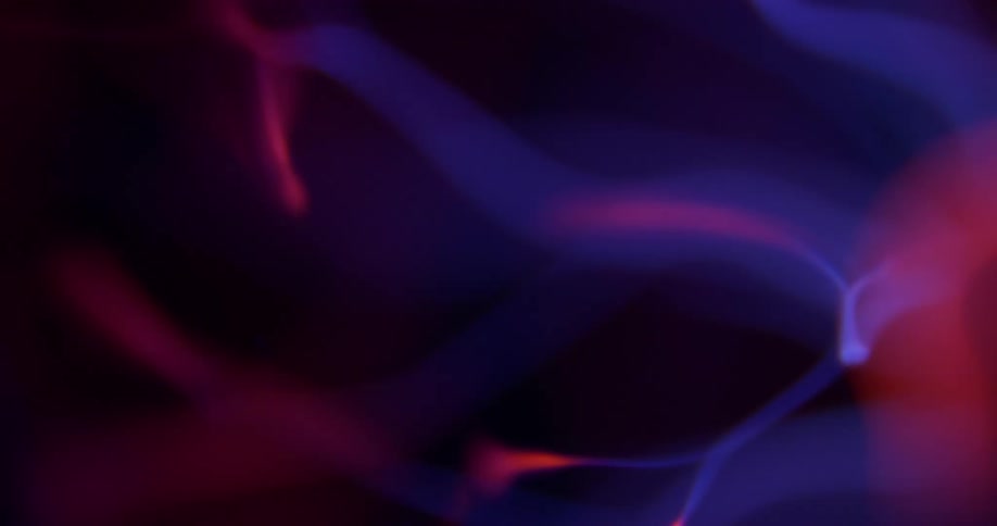 Glowing purple and pink wisps waver and extend from a luminous pink object