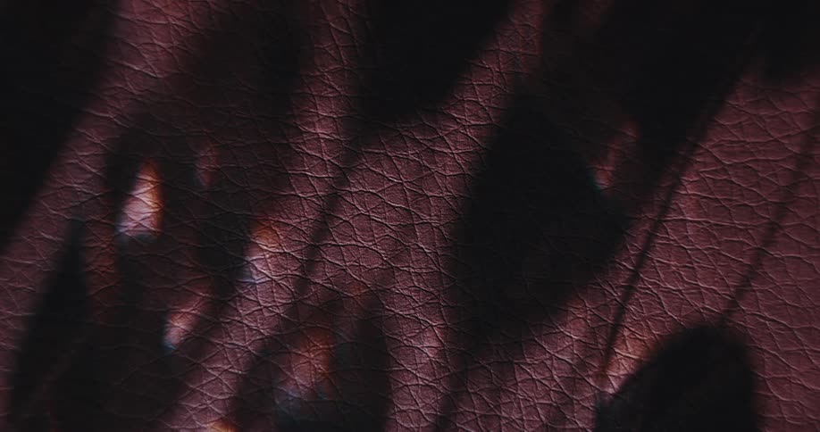 A leather texture with a shadow passing through it