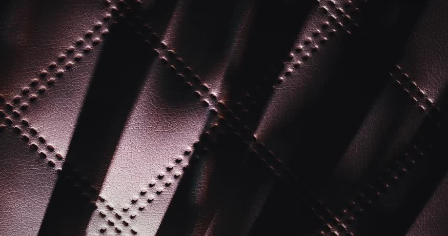 Shadows over textured brown leather