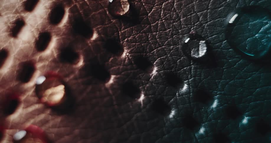 Water drops on a white leather fabric