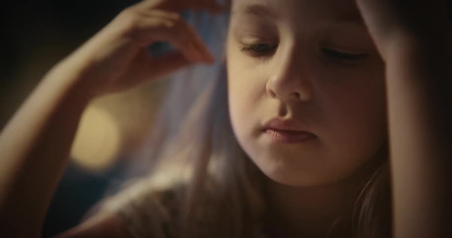 Portrait of a little girl with a bored facial expression