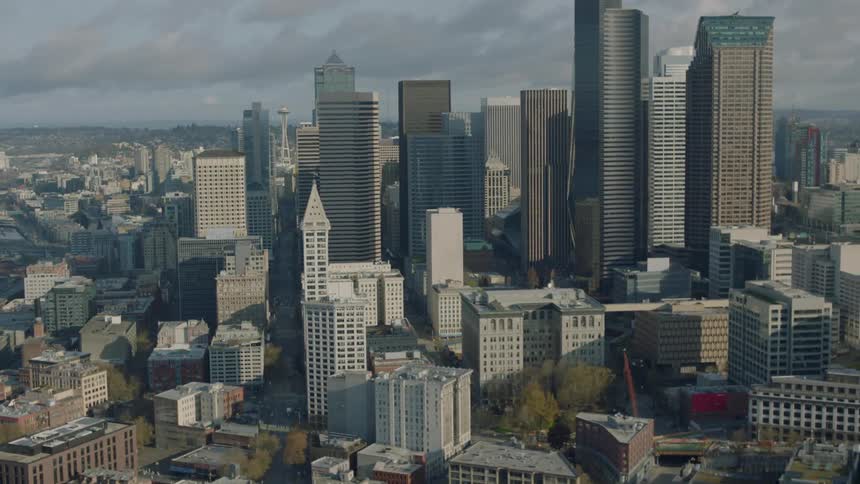 A large city with many tall buildings on a cloudy day