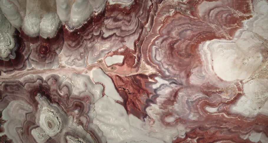 Aregion with several rock formations with reddish colored soil