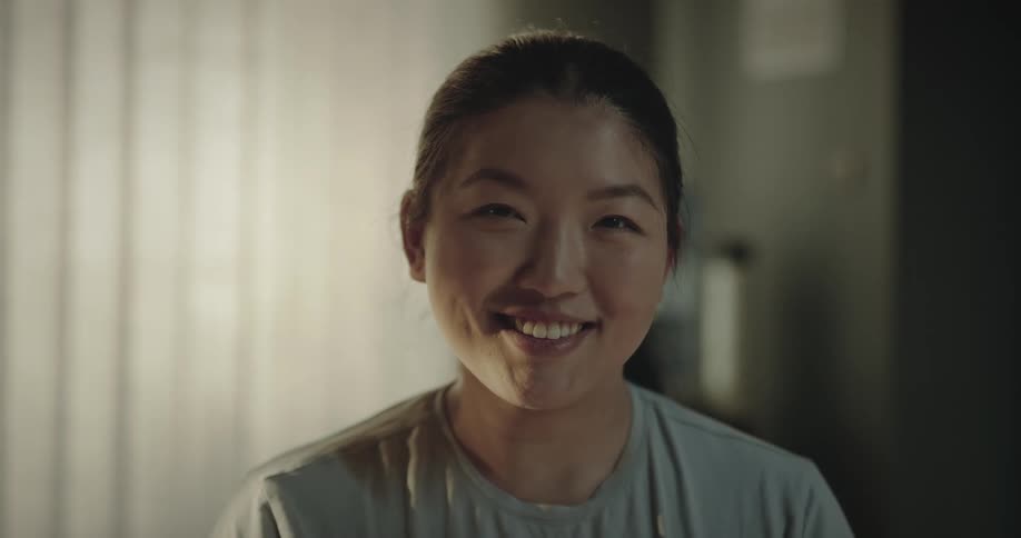 Close up of the face of a woman sitting at the hospital