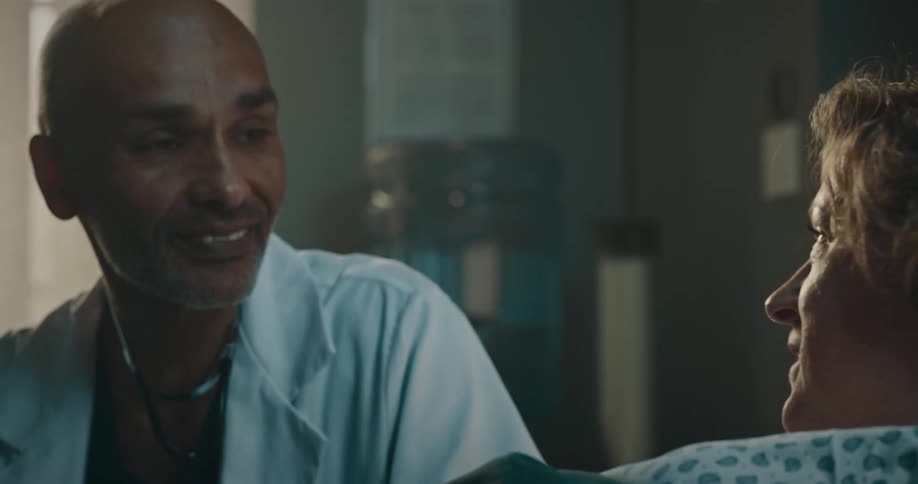A doctor talking to his patient in the hospital