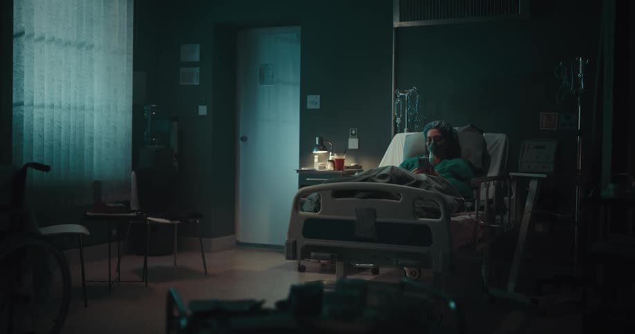 A woman is resting in the hospital bed