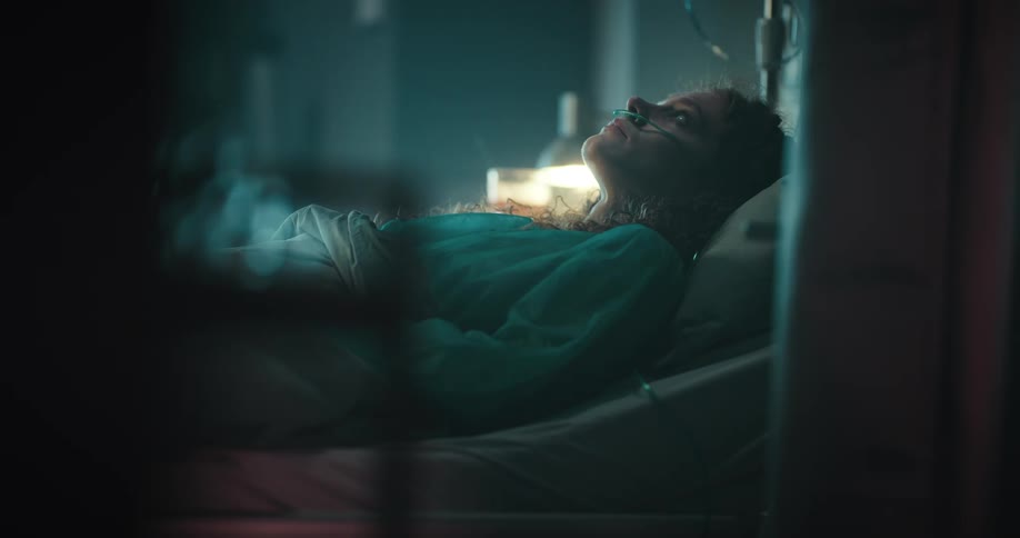 Female patient lying in the hospital bed