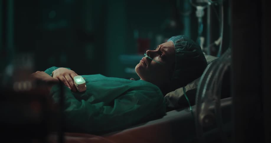 Woman lying in a hospital bed waiting for a procedure