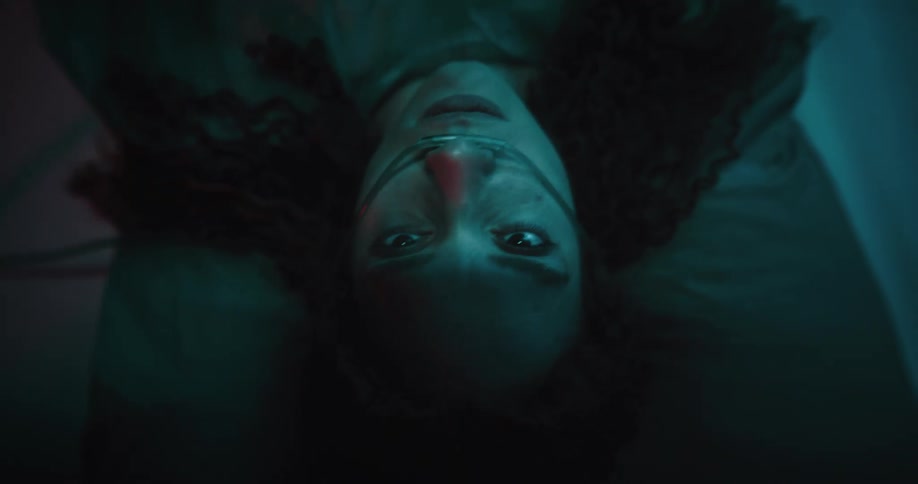 A woman is riding in an ambulance